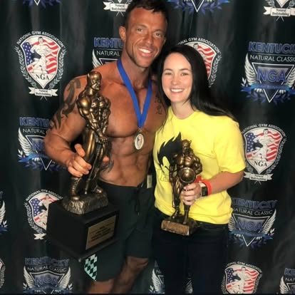 Two Legion athletes holding trophies at the NGA Kentucky Natural Classic