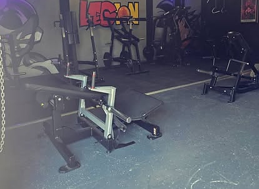 Training machines beneath the LEGION graffiti wall